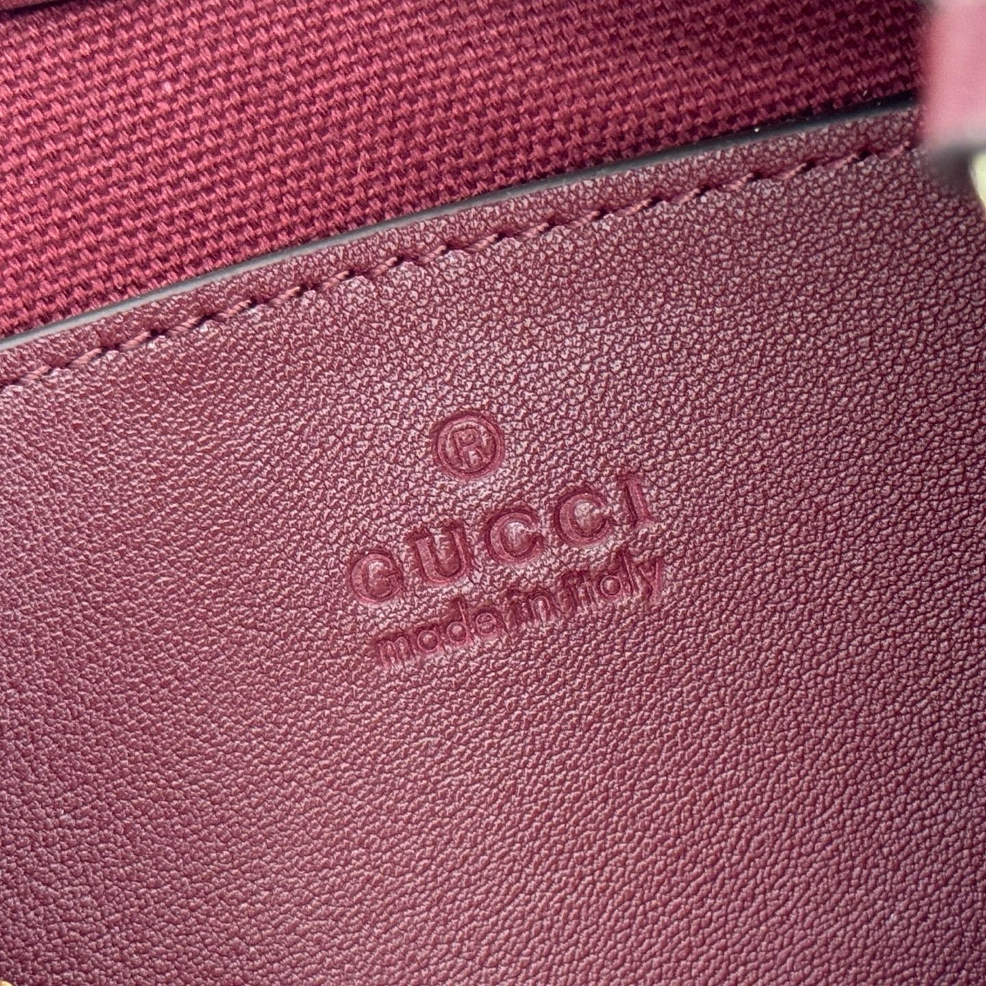 GUCCI 26S EMBLEM BUCKET BAG 22 IN DARK RED COATED FABRIC
