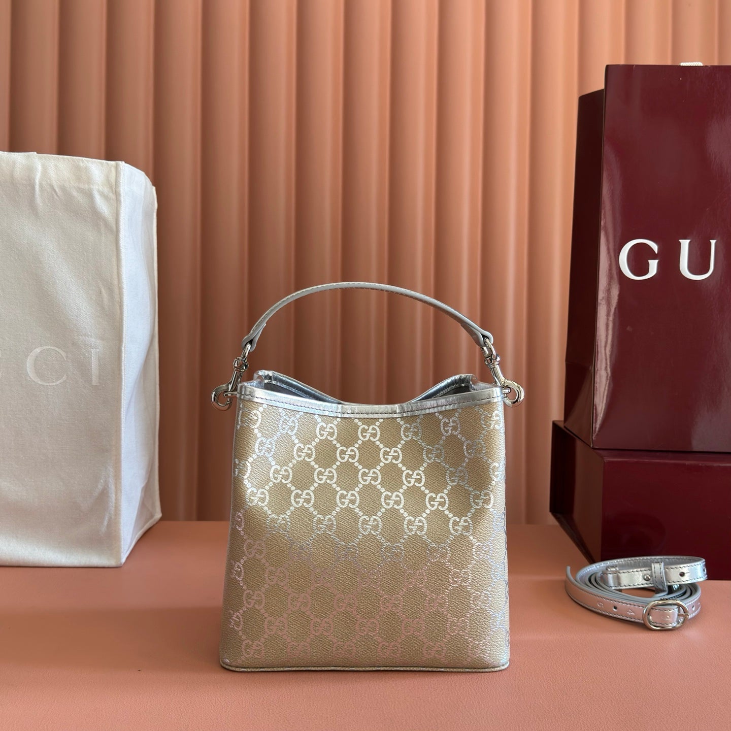 GUCCI 26S EMBLEM BUCKET BAG 19 IN BEIGE AND SILVER CANVAS