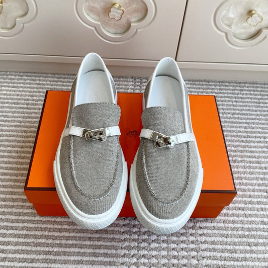 HERMES 25S SLIP-ON IN LIGHT GREY CANVAS WITH SILVER HARDWARE