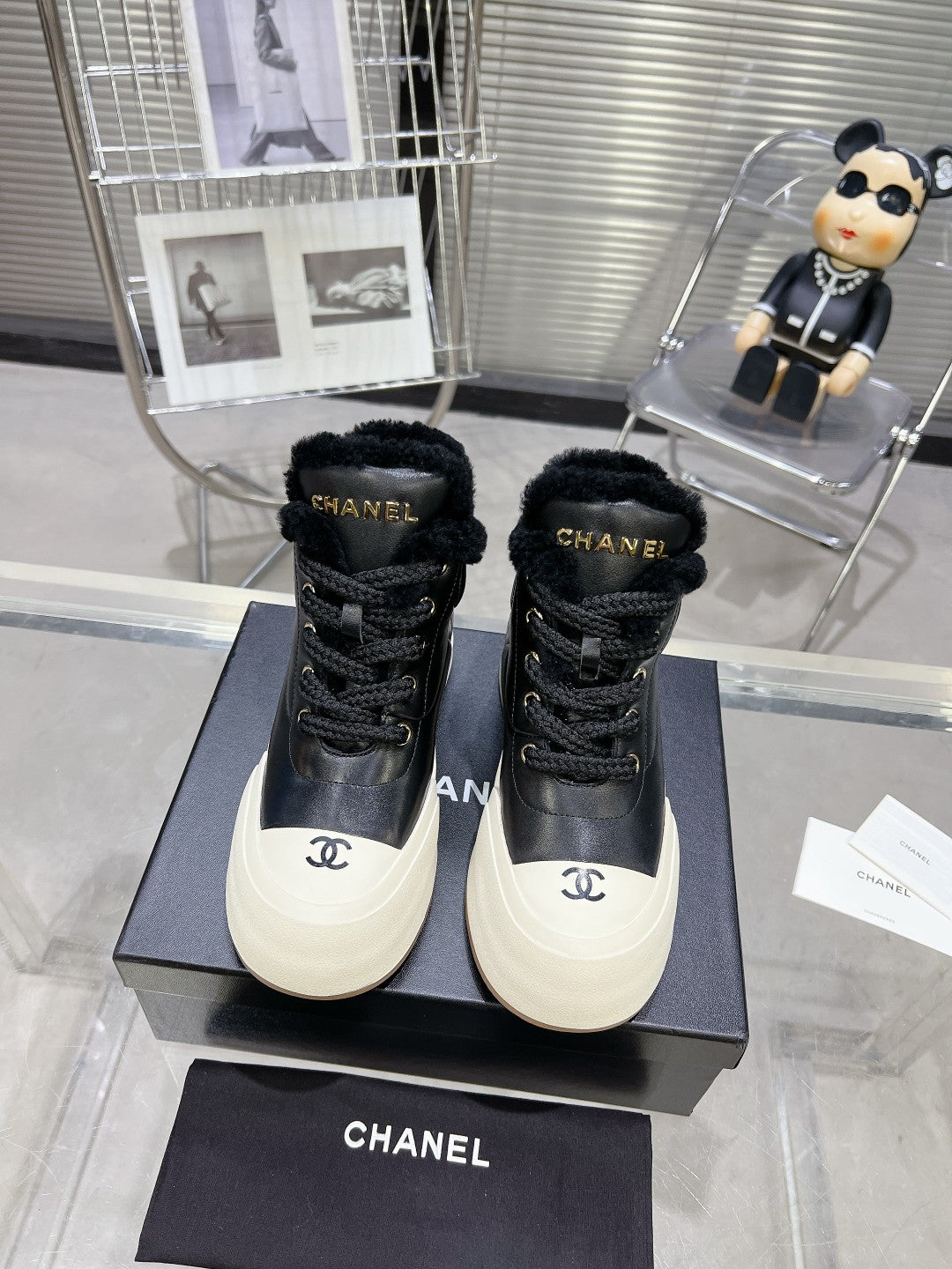 CHANEL MARTIN BOOTS IN BLACK CALFSKIN AND LAMB FUR LINING