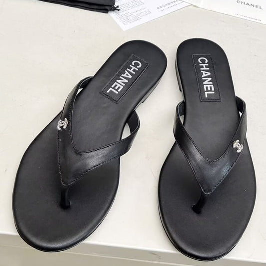 CHANEL THONG SLIPPERS IN BLACK COWHIDE