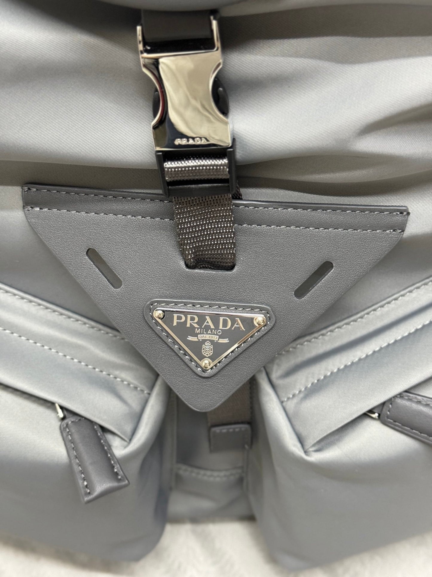 PRADA TRIANGLE LOGO BACKPACK 42 IN RHINO GRAY RE-NYLON